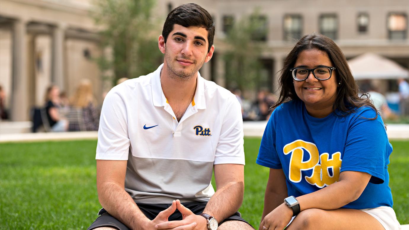 Students sitting on grass